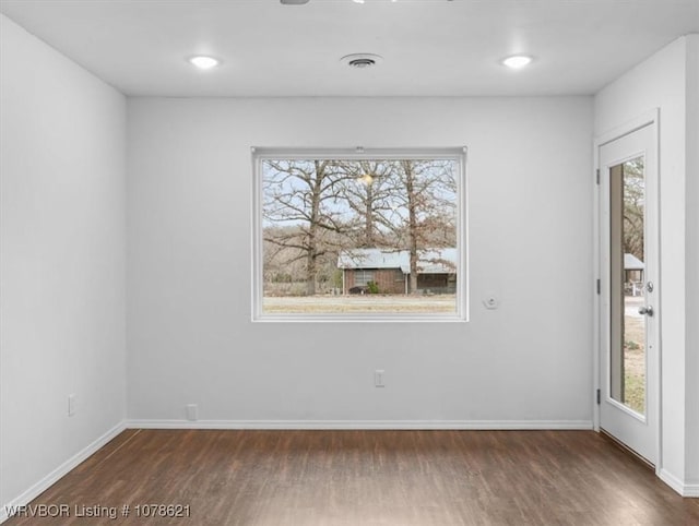 empty room featuring dark hardwood / wood-style floors