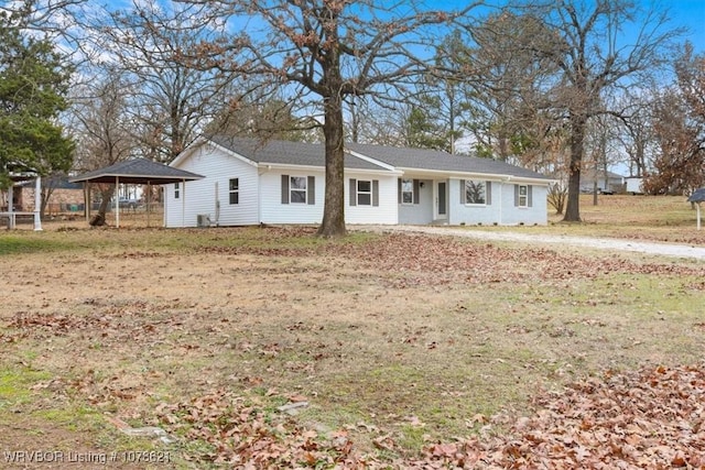 ranch-style house featuring a front lawn