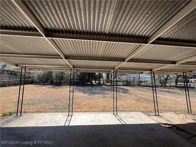 view of parking / parking lot with fence