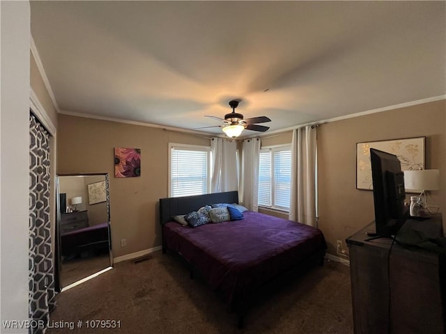 bedroom with visible vents, a ceiling fan, dark carpet, crown molding, and baseboards