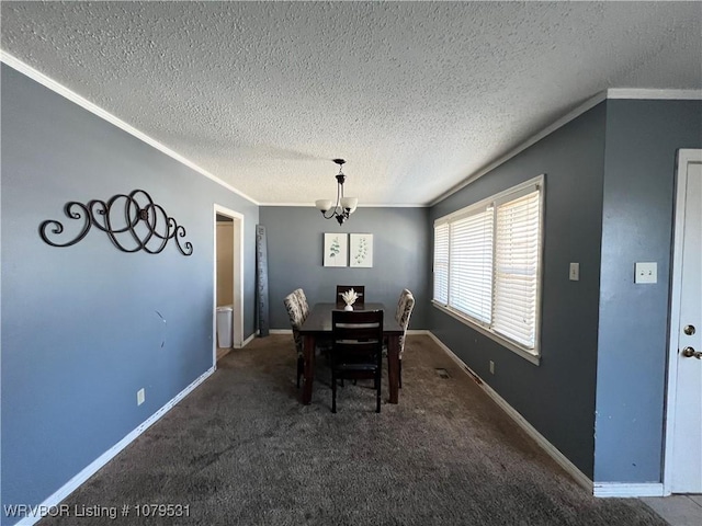 carpeted dining room featuring a chandelier, a textured ceiling, baseboards, and ornamental molding