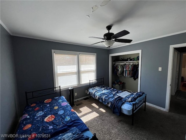 carpeted bedroom featuring a closet, a ceiling fan, crown molding, and baseboards