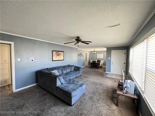 living area featuring visible vents, ornamental molding, a ceiling fan, a textured ceiling, and carpet