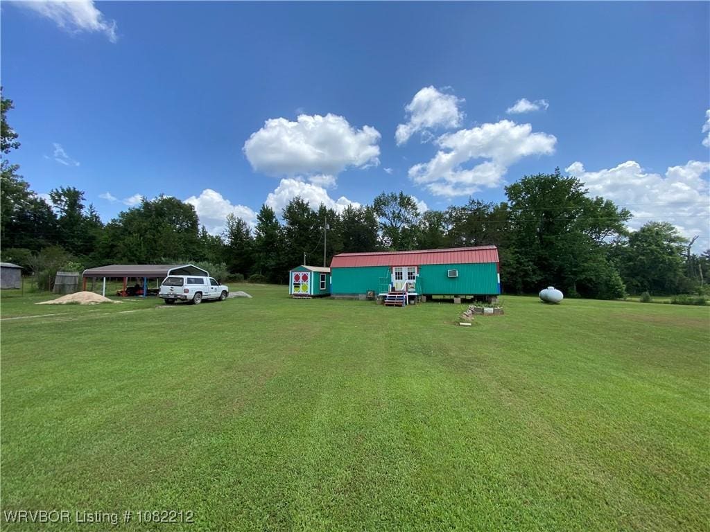 10418 Friendly Ln, Mulberry, AR 72947 - view of grassy yard featuring a detached carport