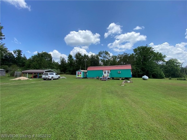 10418 Friendly Ln, Mulberry, AR 72947 - view of grassy yard featuring a detached carport