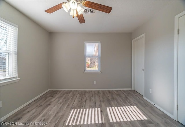 8915 Gary St, Fort Smith, AR 72903 - unfurnished room with wood finished floors, a ceiling fan, and baseboards