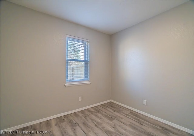 unfurnished room featuring light wood-type flooring