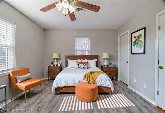 8915 Gary St, Fort Smith, AR 72903 - bedroom featuring wood finished floors, baseboards, and ceiling fan