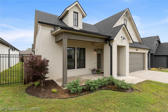9101 Birkshire Pl, Fort Smith, AR 72916 - view of front of home with concrete driveway, an attached garage, brick siding, and a front yard