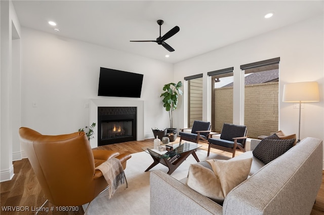 9101 Birkshire Pl, Fort Smith, AR 72916 - living room with recessed lighting, ceiling fan, a lit fireplace, and wood finished floors