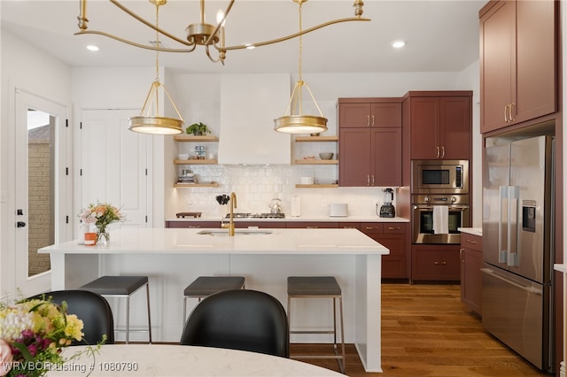 9101 Birkshire Pl, Fort Smith, AR 72916 - kitchen with wood finished floors, open shelves, light countertops, appliances with stainless steel finishes, and tasteful backsplash