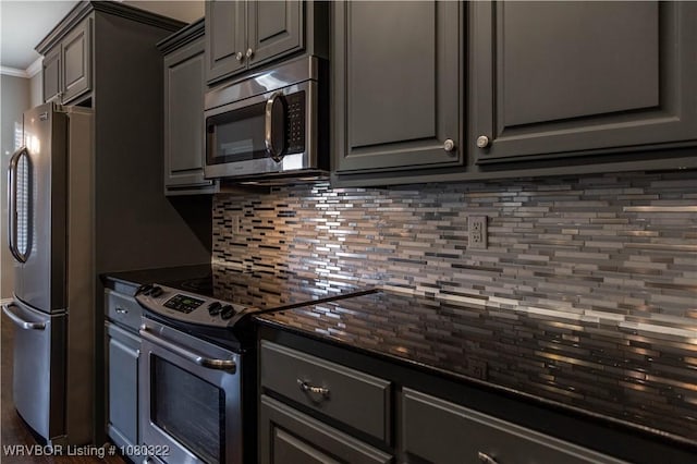 kitchen with backsplash, crown molding, appliances with stainless steel finishes, and gray cabinets