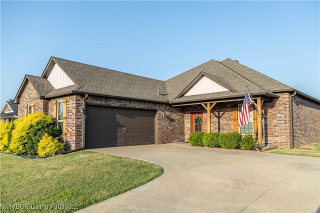 view of front of property with a shingled roof, driveway, brick siding, and a garage