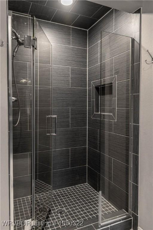 bathroom with a shower stall