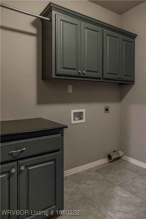 laundry room featuring hookup for an electric dryer, baseboards, cabinet space, and hookup for a washing machine