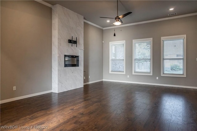 unfurnished living room with crown molding, ceiling fan, baseboards, dark wood-type flooring, and visible vents