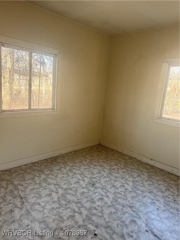 unfurnished room featuring carpet flooring