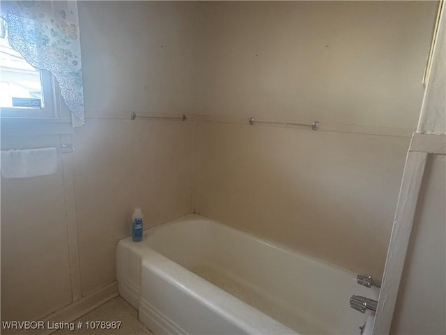 bathroom featuring a tub