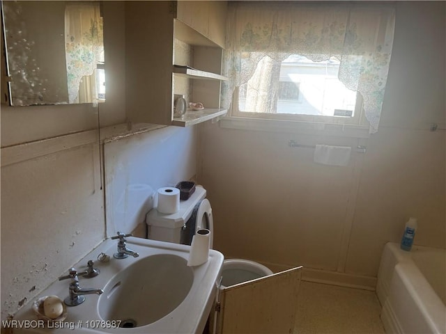 bathroom with sink and a tub