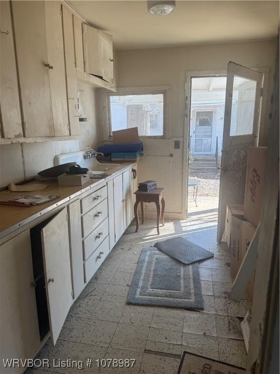 kitchen with white cabinetry and sink