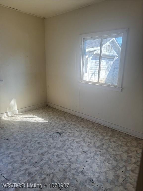 spare room featuring carpet flooring