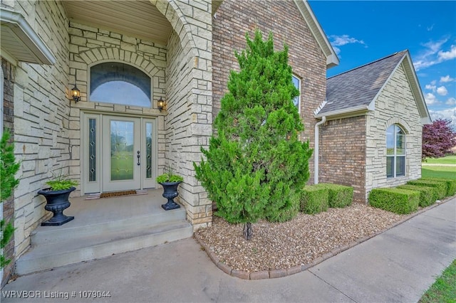 2601 Bugscuffle Rd, Lavaca, AR 72941 - doorway to property featuring brick siding, a shingled roof, and stone siding