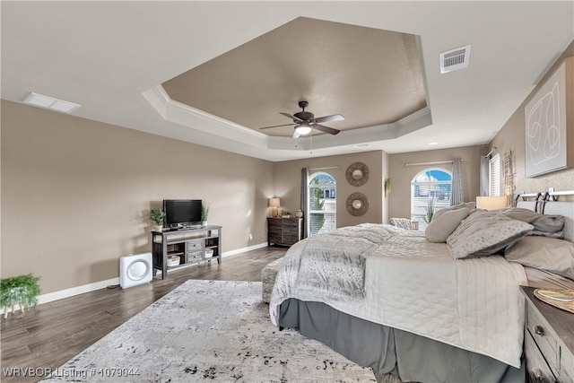 2601 Bugscuffle Rd, Lavaca, AR 72941 - bedroom featuring a raised ceiling, wood finished floors, ceiling fan, and ornamental molding