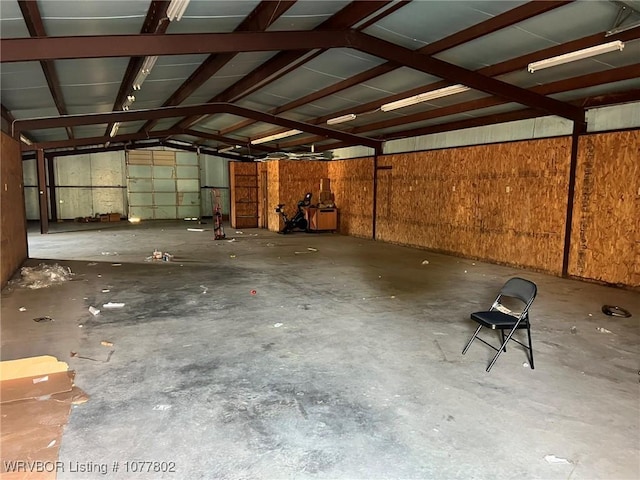 garage featuring wooden walls