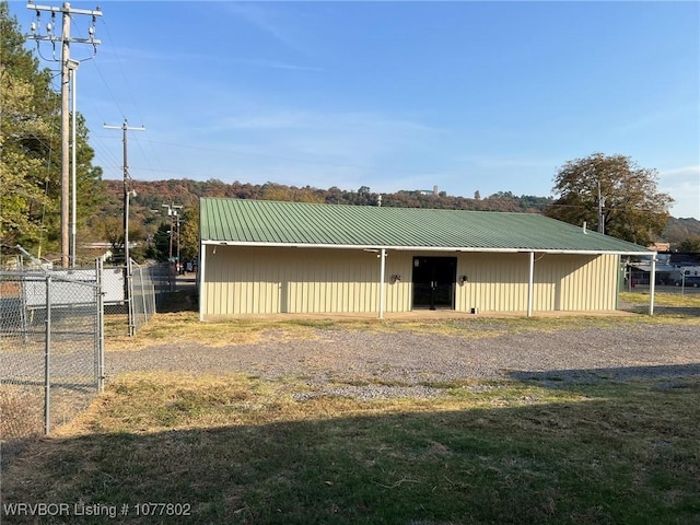 view of outbuilding featuring a lawn