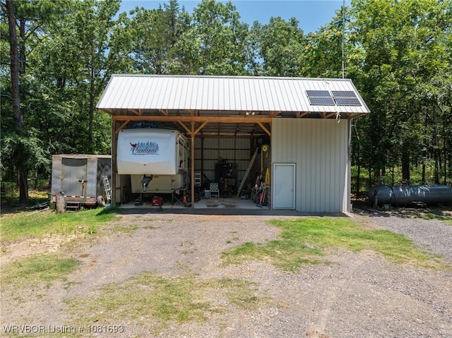 11667 Falling Rock Rd, Havana, AR 72842 - garage featuring driveway and a carport