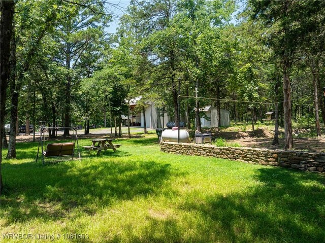 11667 Falling Rock Rd, Havana, AR 72842 - surrounding community featuring a shed and a lawn
