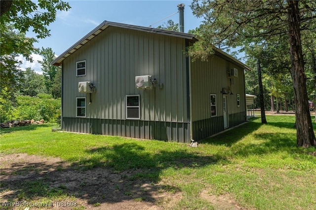 11667 Falling Rock Rd, Havana, AR 72842 - view of side of home with a yard and board and batten siding