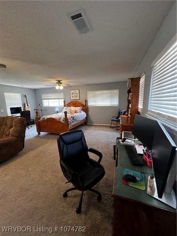 bedroom with ceiling fan and carpet floors