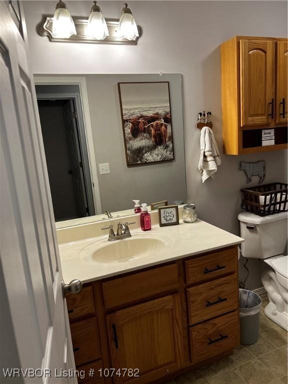 bathroom with vanity and toilet