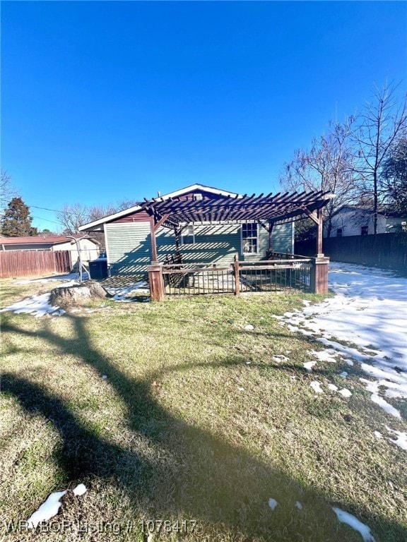 view of dock with a pergola and a yard