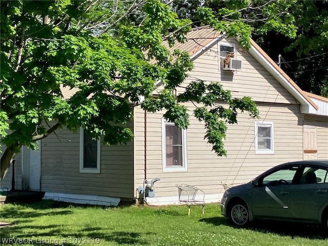 view of side of home featuring a yard