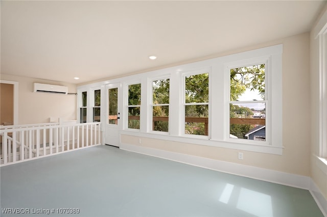 unfurnished sunroom with an AC wall unit