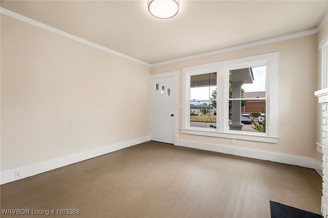 empty room featuring crown molding and wood-type flooring