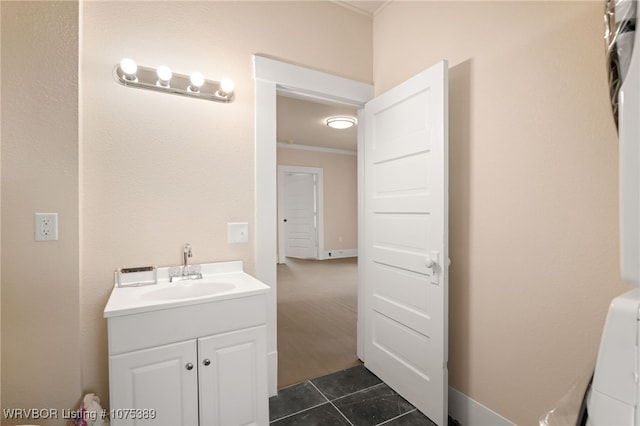 bathroom with tile patterned floors, vanity, and ornamental molding