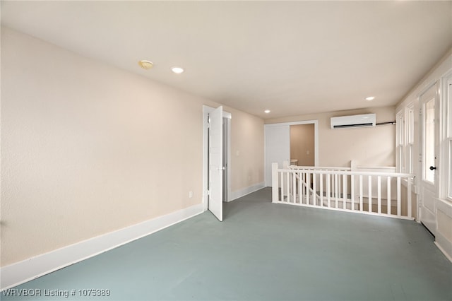 spare room featuring a wall mounted AC