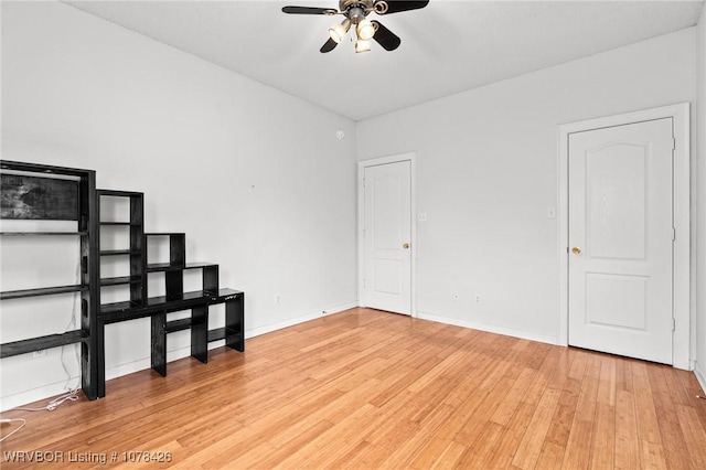 spare room with ceiling fan and hardwood / wood-style flooring