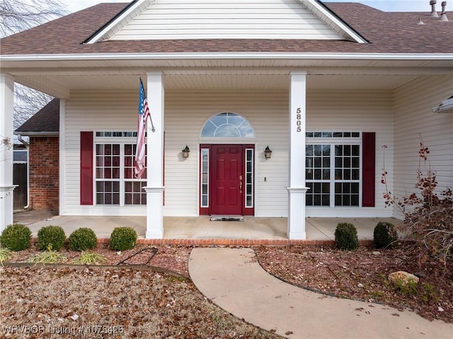 doorway to property with a porch