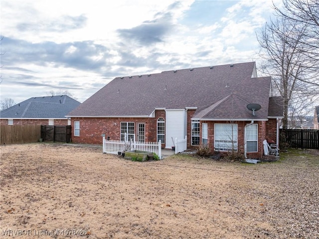 rear view of property with a patio area