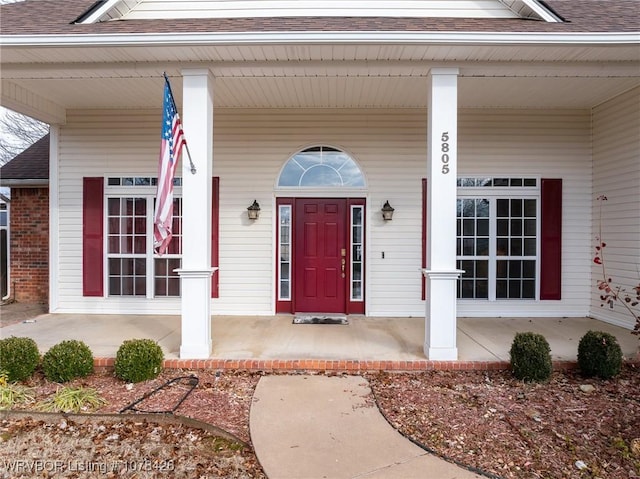 doorway to property with a porch