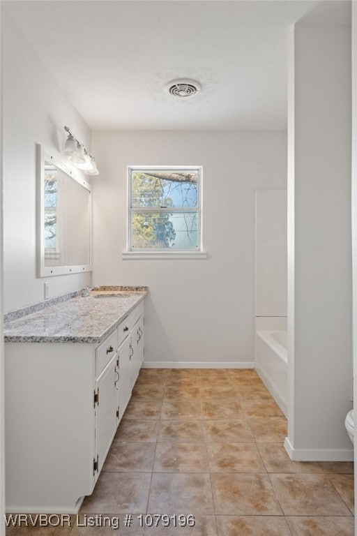 full bathroom with tile patterned flooring, visible vents, vanity, and baseboards