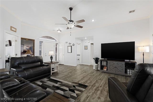 living room with crown molding, ceiling fan, and hardwood / wood-style flooring