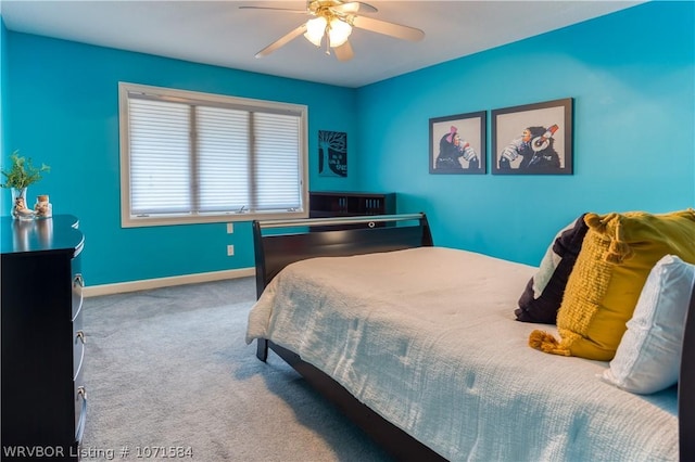 bedroom with ceiling fan and carpet