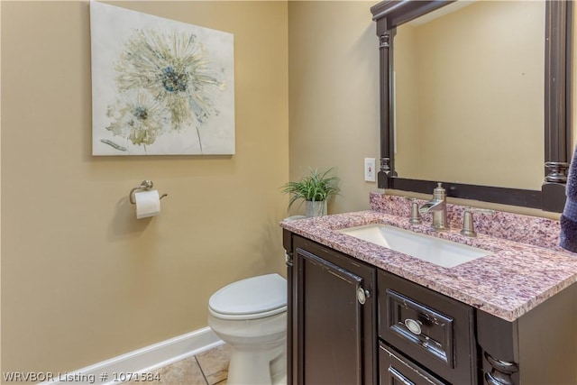 bathroom featuring tile patterned floors, vanity, and toilet