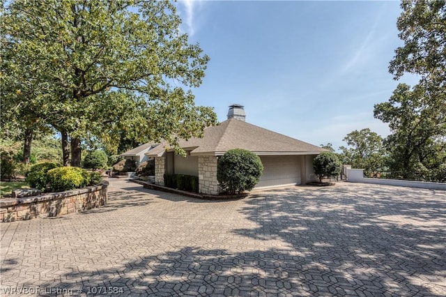 view of property exterior with a garage