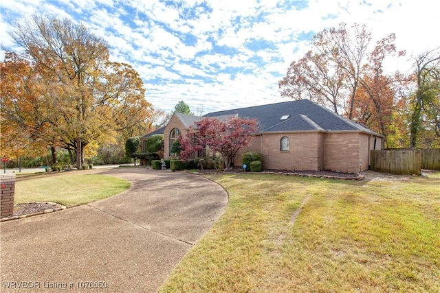 ranch-style house with a front yard